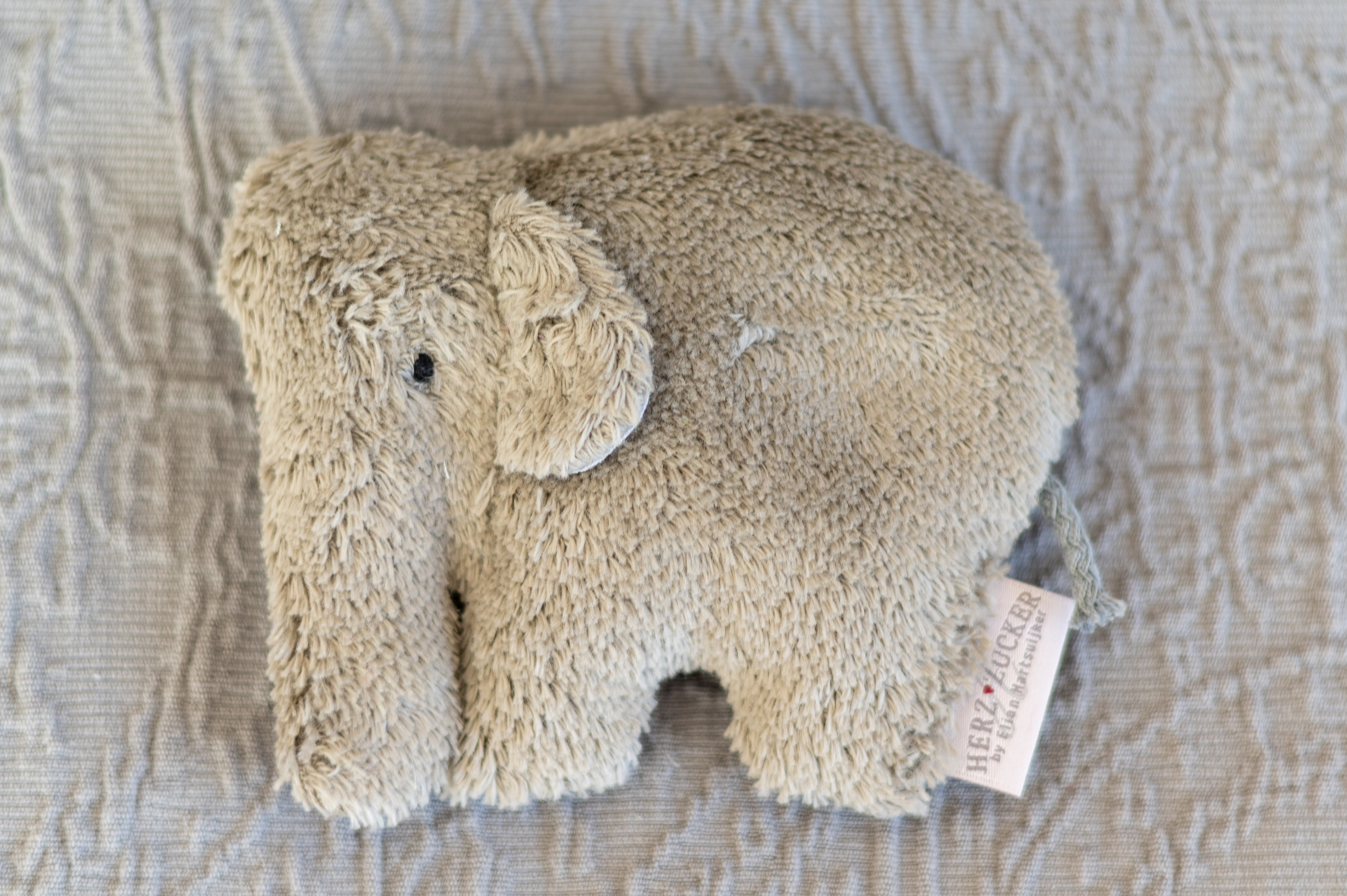 Babykissen Ole der Elefant mit Traubenkernfüllung - Bio Plüsch